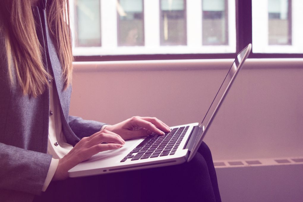 Woman using Macbook Pro.