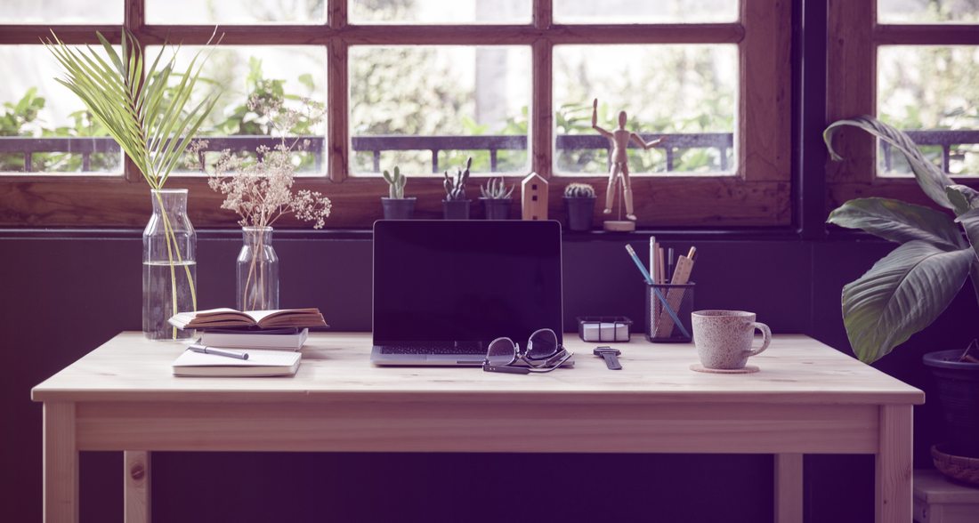 Modern home office with laptop on the desk.