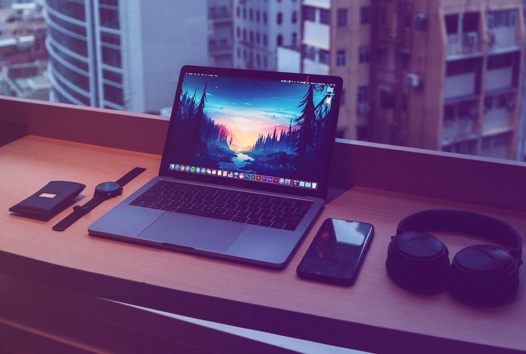 MacBook Pro on the wooden desk.