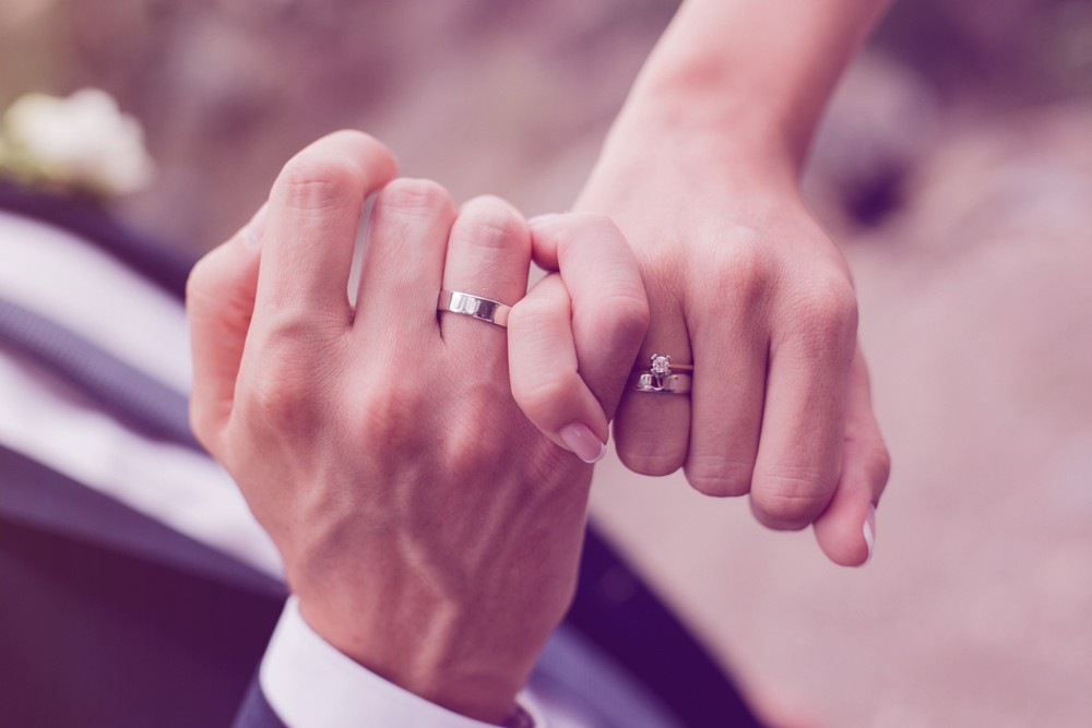 Man and woman with wedding ring.