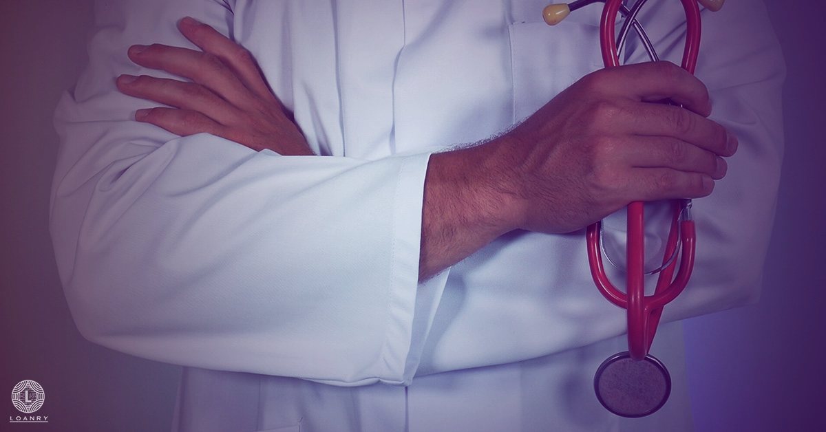 Crop close up male doctor wearing white uniform with stethoscope.