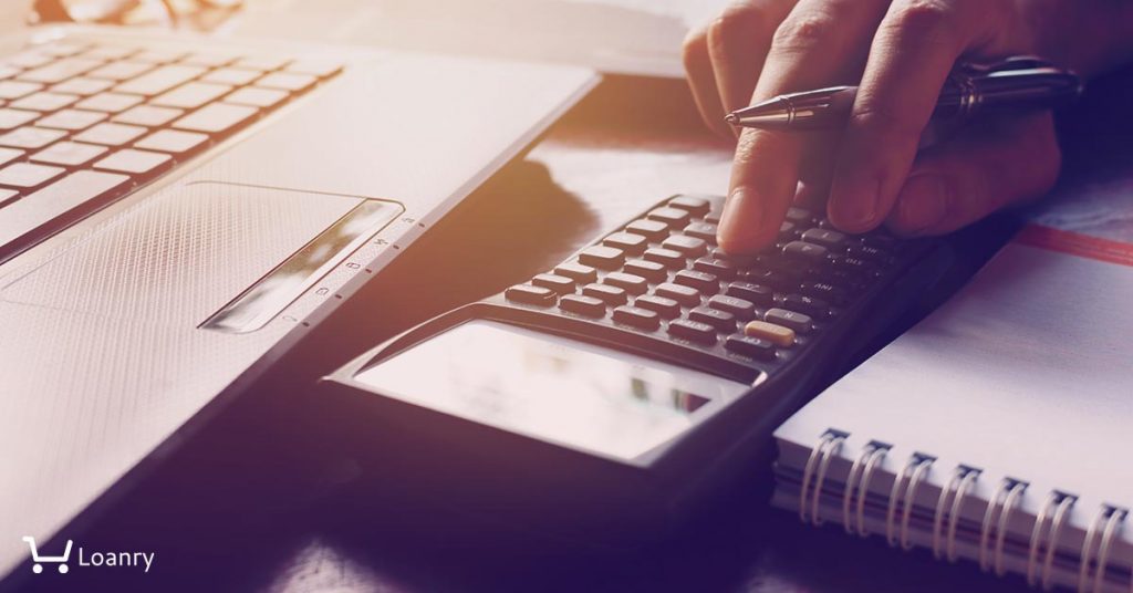A man using a calculator