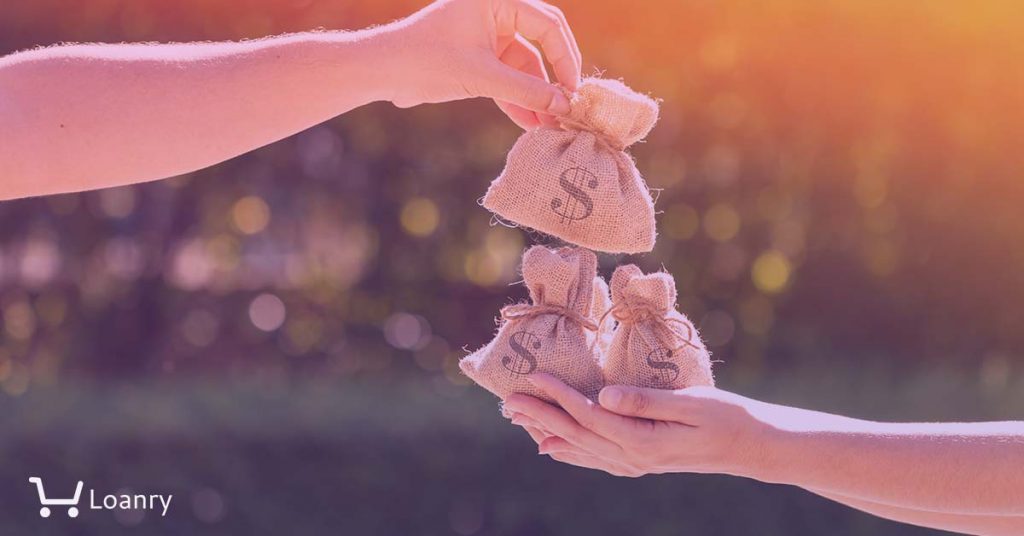 A man and a women hands hold a money bags