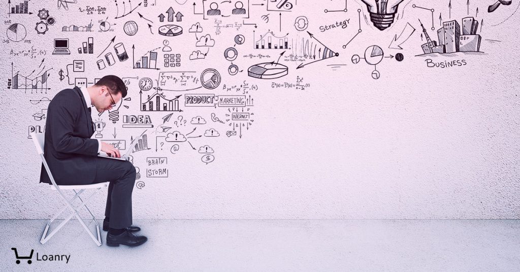 Side view of young businessman sitting on chair in interior with business sketch.