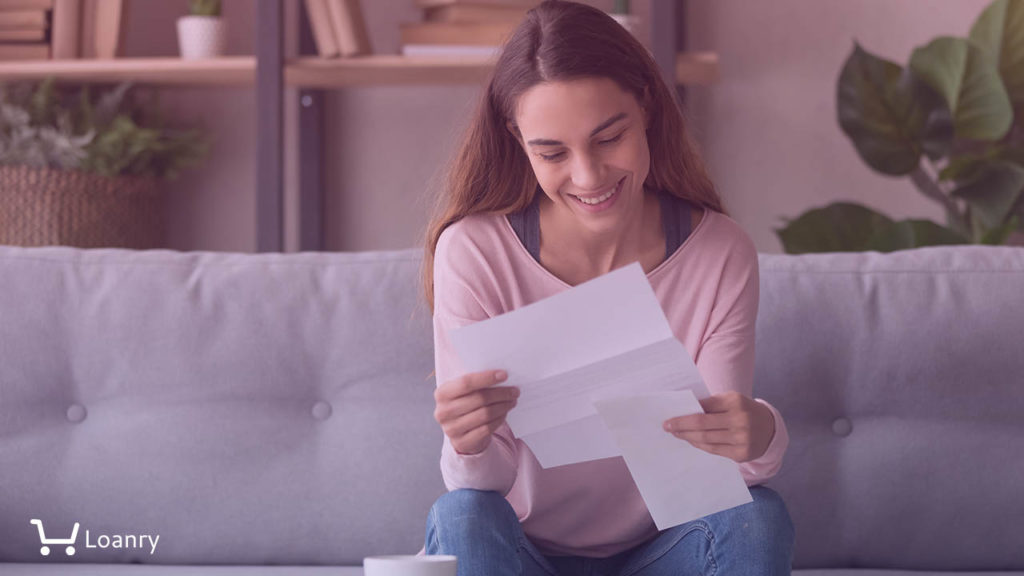 Happy smiling millennial girl holding paper document, received good news letter, university admission notification.