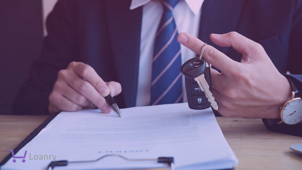 Successful businessman offering a car key with contract.