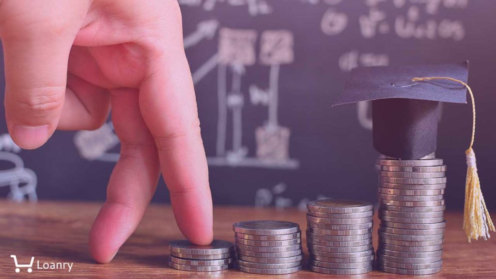 Fingers walking on pile coins saving to hat graduation model