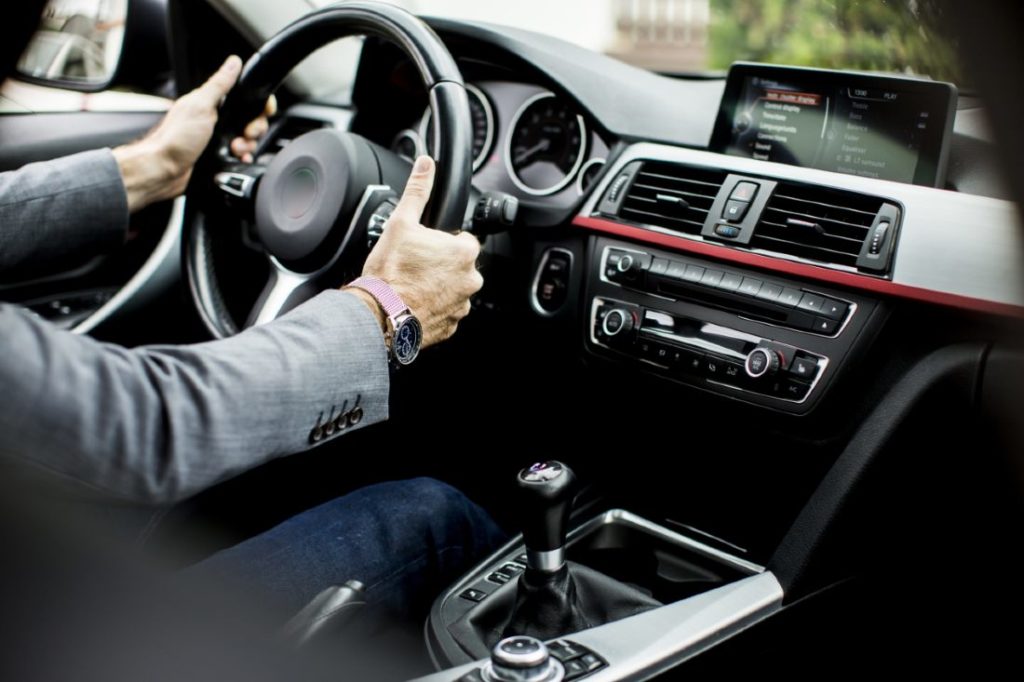 Young man driving in the modern car