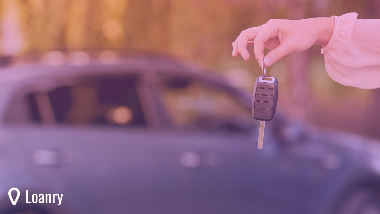 Young woman holding car keys. Car loan.