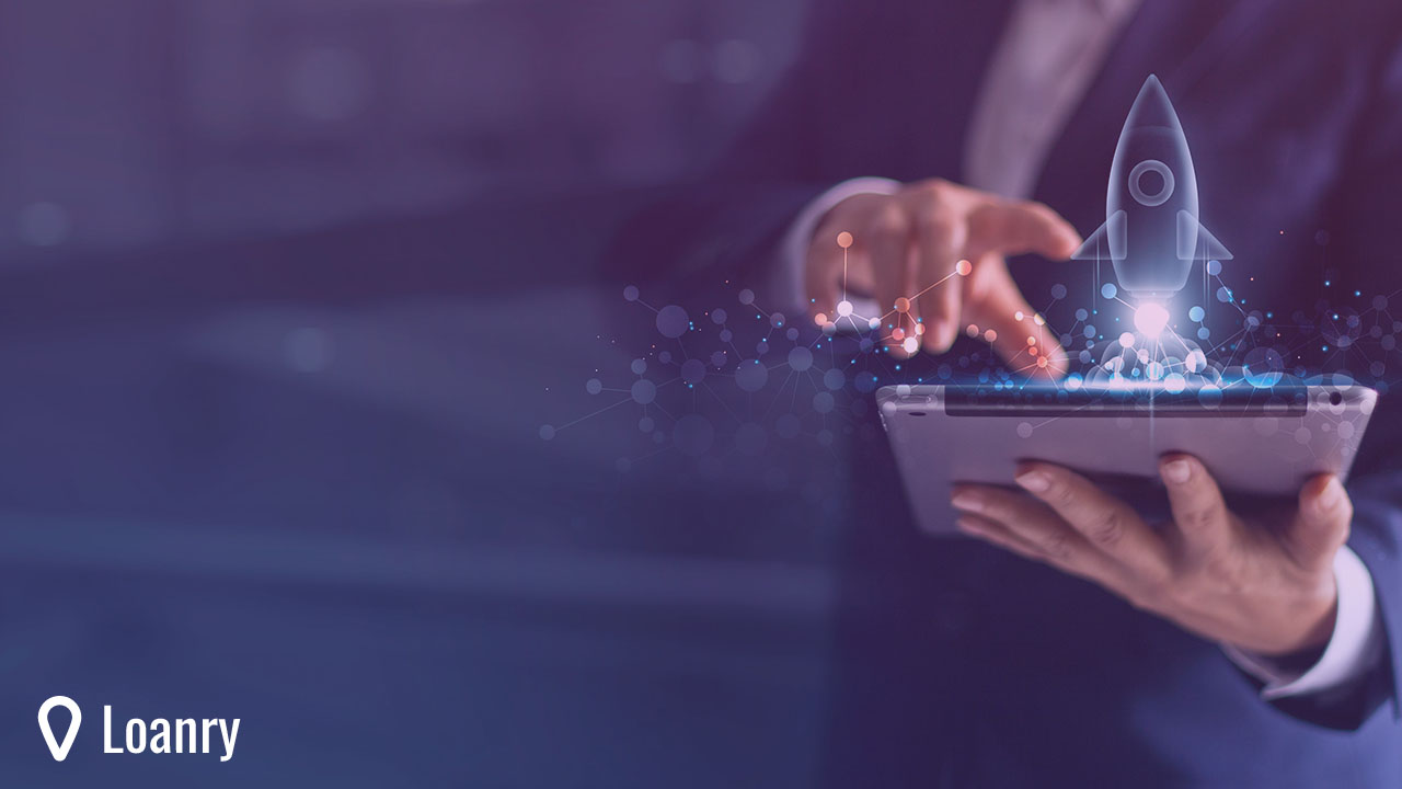 Businessman holding tablet and icon transparent rocket is launching and soar flying out from screen.