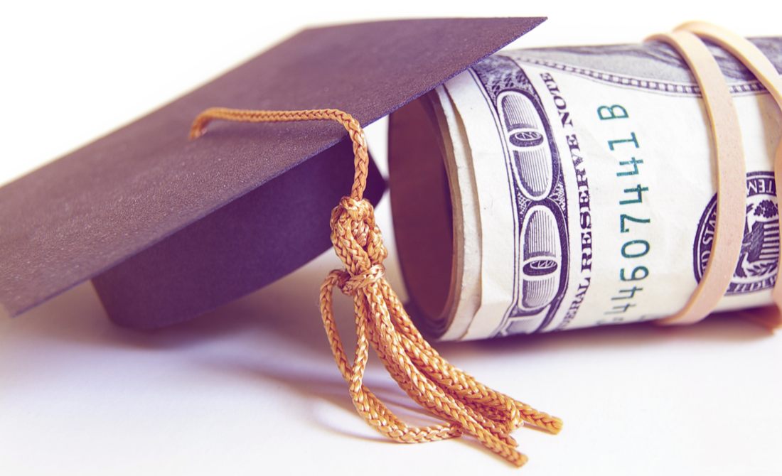 Graduation cap and cash roll.